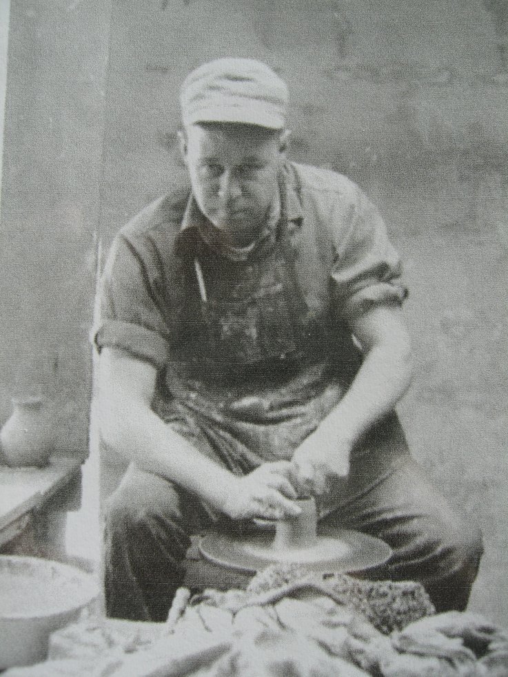 Fred Wills throwing a vase on the potter's wheel