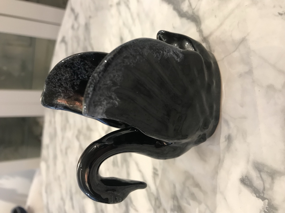 Late commercial Van Briggle swan planter in black high-gloss glaze with blue and white drip on the wing